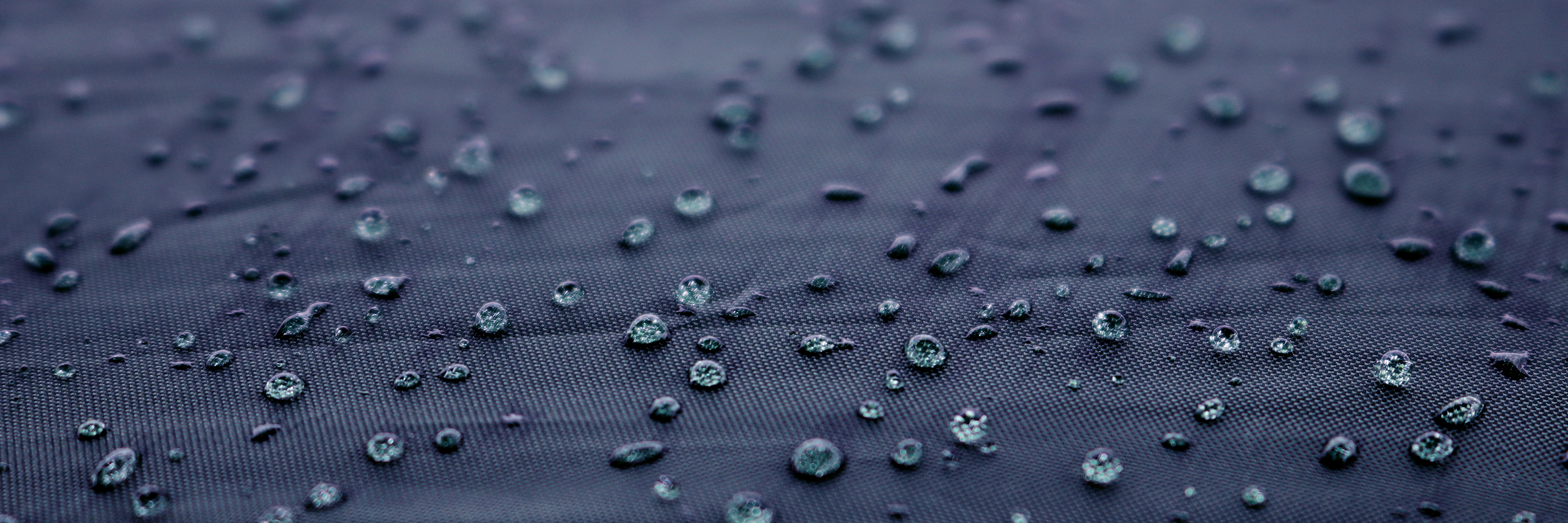 Waterproof fabric sprinkled with water droplets